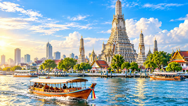 Wat Arun on the Chao Phraya river in Bangkok with a passenger boat